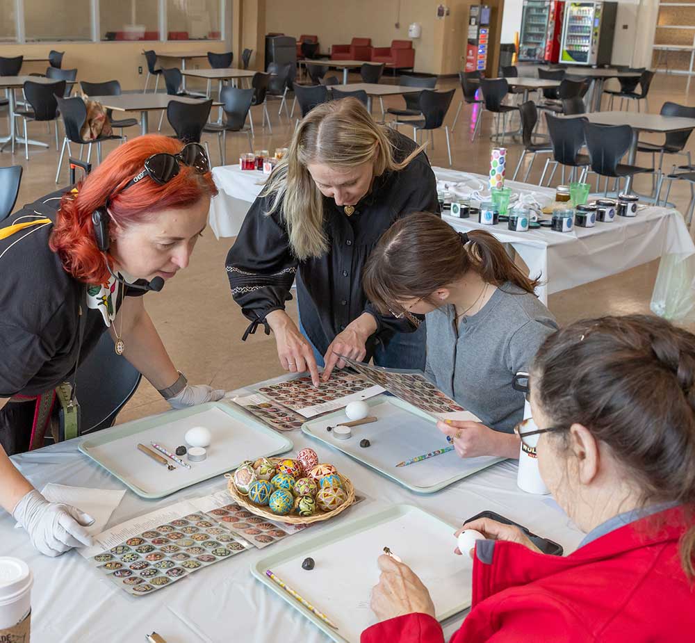 Students and staff paint eggs using Pysanky method