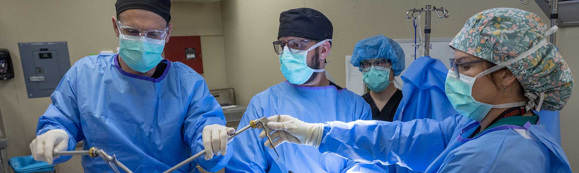 Surgical tech assisting with surgery